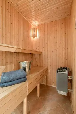 a sauna with a wooden bench in a room at Modern Cabin With Ski In-Out In Hafjell in Øyer