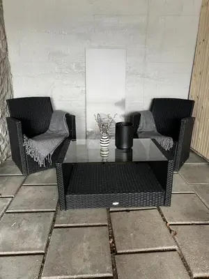 two chairs and a glass table in a room at Eidfjord Fjell in Eidfjord