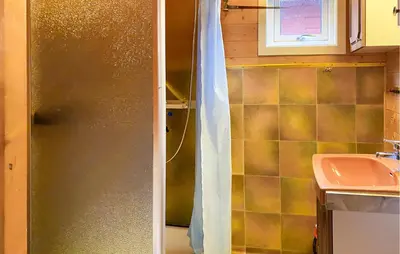 a bathroom with a shower and a sink at 3 Bedroom Amazing Home In Haddal in Haddal