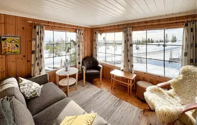 a living room with a couch and chairs and windows at Beautiful Home In Vang På Hedmarken in Sæli