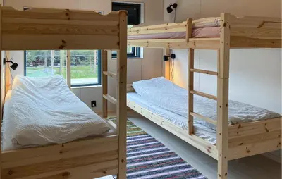 two bunk beds in a room with a window at 2 Bedroom Gorgeous Home In Bjorli in Bjorli