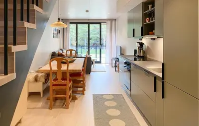 a kitchen with a table and a dining room at 2 Bedroom Gorgeous Home In Bjorli in Bjorli