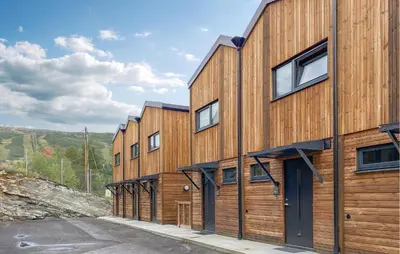 a row of wooden buildings on a hill at 2 Bedroom Gorgeous Home In Bjorli in Bjorli