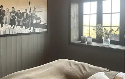 a bedroom with a picture on the wall next to a window at Stunning Apartment In Hovden I Setesdal in Hovden
