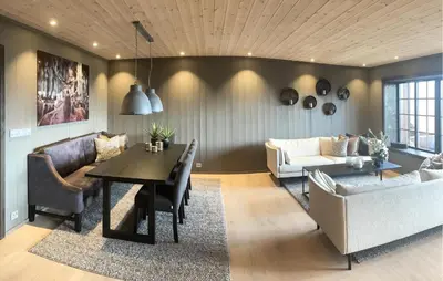 a living room with a table and a couch at Stunning Apartment In Hovden I Setesdal in Hovden