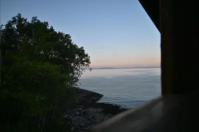 a view of the ocean from a window at En perle i Trondheimsfjorden in Trondheim