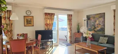 a living room with a couch and a table at Midt i byn in Bergen