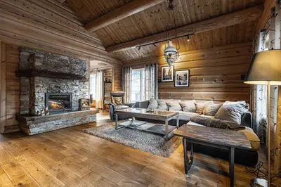 a living room with a couch and a fireplace at Vacation house in Hemsedal in Hemsedal