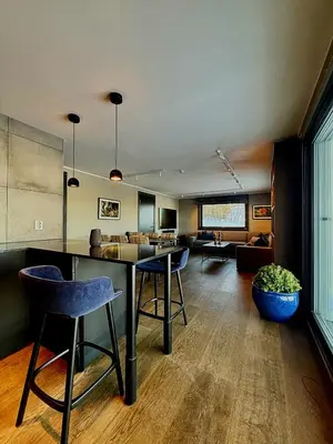 a living room with a table and chairs at Geilolie - apartment in Geilo in Geilo