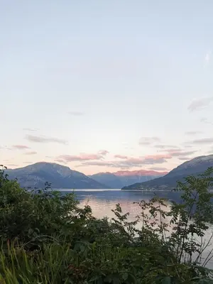 a view of a lake with mountains in the background at Charming guest house with amazing view in Kvam