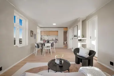 a living room with a couch and a table at Stay Panorama - Best view in Bergen l Studio in Bergen