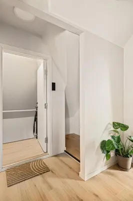 a hallway with a door leading to a bathroom at Stay Panorama - Best view in Bergen l 2-Bedroom in Bergen