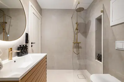 a bathroom with a shower and a sink and a mirror at Stay Panorama - Best view in Bergen l 2-Bedroom in Bergen