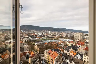 a view of a city from a window at Stay Panorama - Best view in Bergen l 2-Bedroom in Bergen