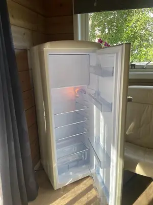 an empty refrigerator with its door open at Modern holiday home in Ålesund