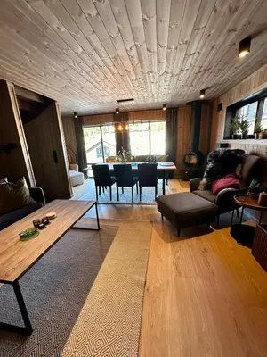 a living room with a couch and a table at Ski in and ski out in the middle of the slopes in Favang