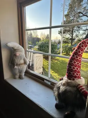 two gnome figurines sitting on a window sill at Cozy rooms with private bathroom close to Hønefoss in Knestang