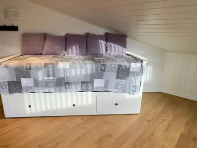 a bedroom with a bed in a attic at 4 star holiday home in Tjeldstø in Tjeldstø