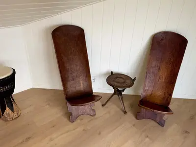 three wooden objects sitting on the floor in a room at 4 star holiday home in Tjeldstø in Tjeldstø