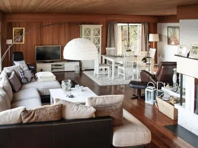 a living room with a couch and a table at 7 person holiday home in Molde in Molde