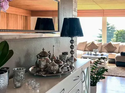 a living room with a table with a lamp on it at 7 person holiday home in Molde in Molde