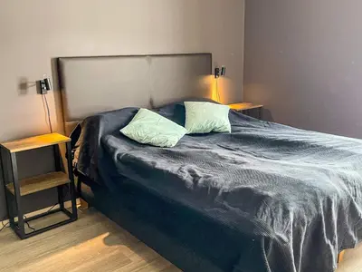 a bedroom with a large bed with two pillows at 4 star holiday home in Hemsedal in Hemsedal