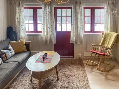 a living room with a couch and a table at 5 person holiday home in Røros in Røros