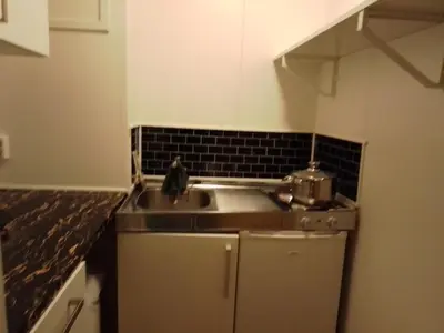 a kitchen with a sink and a counter top at Cozy room away from home in Åmot