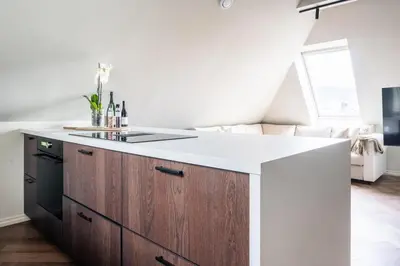 a kitchen with a island with a counter top at Large apartment in historical street in Bergen