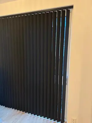 a radiator in a room with black vertical blinds at Helt NY leilighet, Ytre Sandviken i Bergen in Bergen