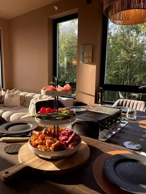 a table with three plates of food on top of it at Luxury apartment with beautiful location in Florvåg