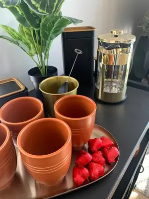 a table with bowls and a plate of strawberries at Bølgen Nyhavna in Trondheim