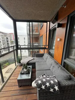 a living room with a couch and a table at Centrally located apartment in Bergen