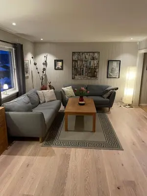 a living room with a couch and a coffee table at Lars sitt hus in Lillehammer