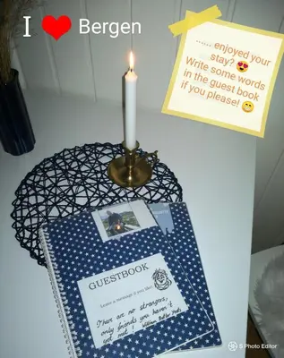 a candle and a table with a candle and a card at Home is where your heart is! in Bergen