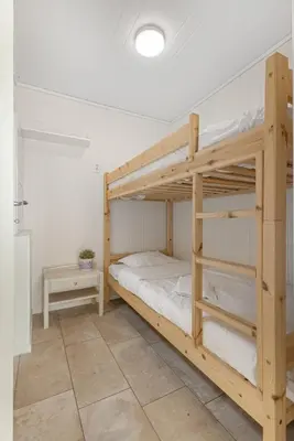 a bedroom with two bunk beds in a room at Stryn Fjord Lodge Faleide in Stryn