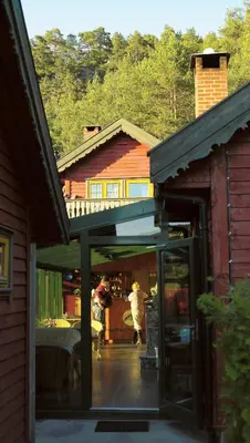 an entrance to a building with people walking in it at Mo Laksegard in Sand