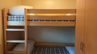 a small room with two bunk beds in it at Aurdal Fjordcamping og Hytter in Aurdal