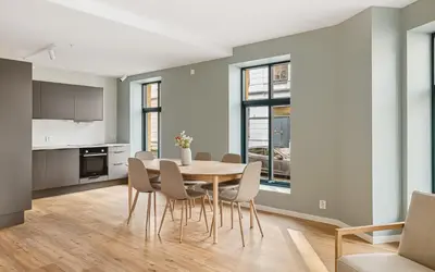 a kitchen and dining room with a table and chairs at HH - Modern Apartments l City Center in Bergen