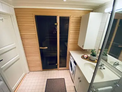 a small bathroom with a sink and a shower at Pellestova Apartments in Hafjell