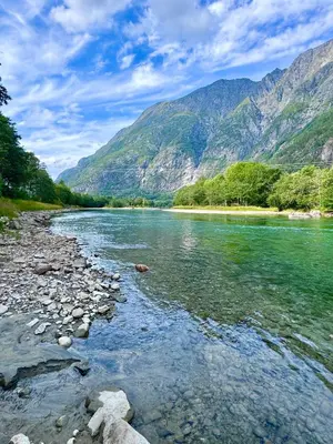 a river with mountains in the background at Bispen Villa Utsikten in Åndalsnes