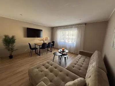 a living room with a couch and a table at Comfortable apartment in Ålesund in Ålesund