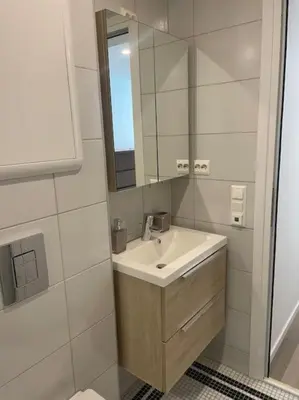 a bathroom with a sink and a mirror at Comfortable apartment in Ålesund in Ålesund
