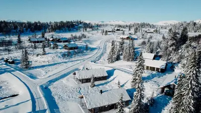 an aerial view of a village covered in snow at Modern Mountain Cabin Near Syningtoppen in Torpo