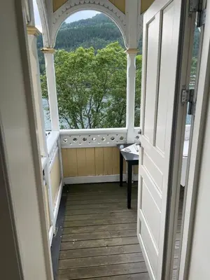 an open door to a room with a view of trees at Apartment in Stryn in Stryn