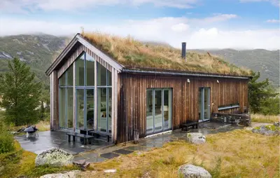 a house with a grass roof on top of a hill at 2 Bedroom Cozy Home In Edland in Vågsli