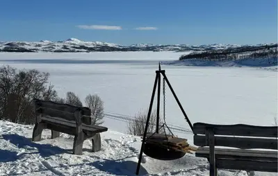 two benches sitting in the snow next to a lake at Awesome Apartment In Rauland in Rauland