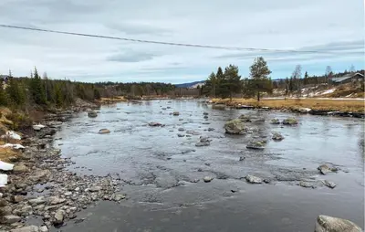 a river with rocks in the water and trees at Nice Apartment In Tisleidalen With Wifi in Tisleidalen