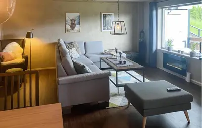 a living room with a couch and a table at Nice Apartment In Tisleidalen With Wifi in Tisleidalen