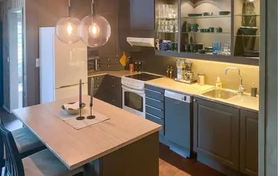 a kitchen with a wooden counter top and a sink at Nice Apartment In Tisleidalen With Wifi in Tisleidalen